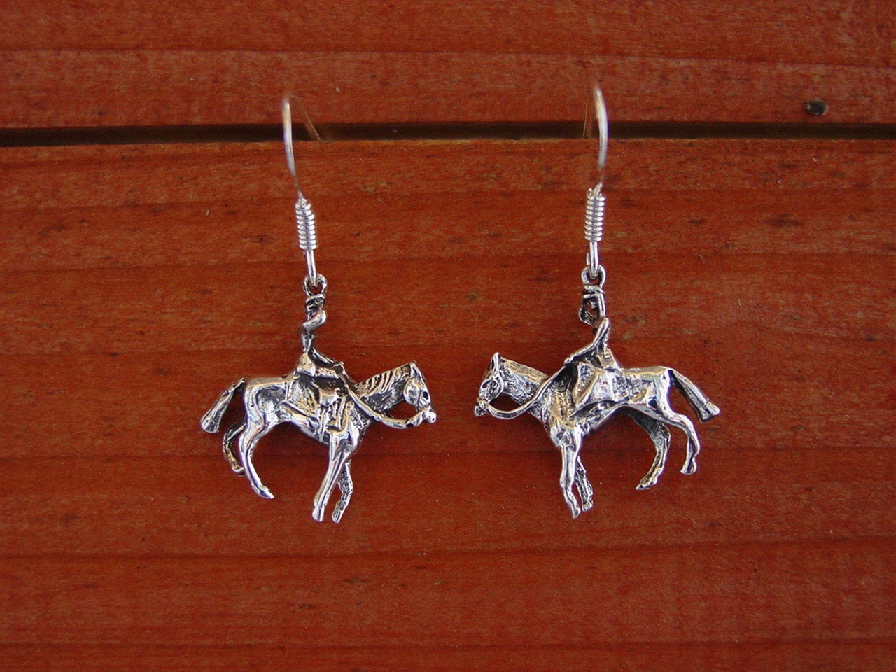 women riding earrings