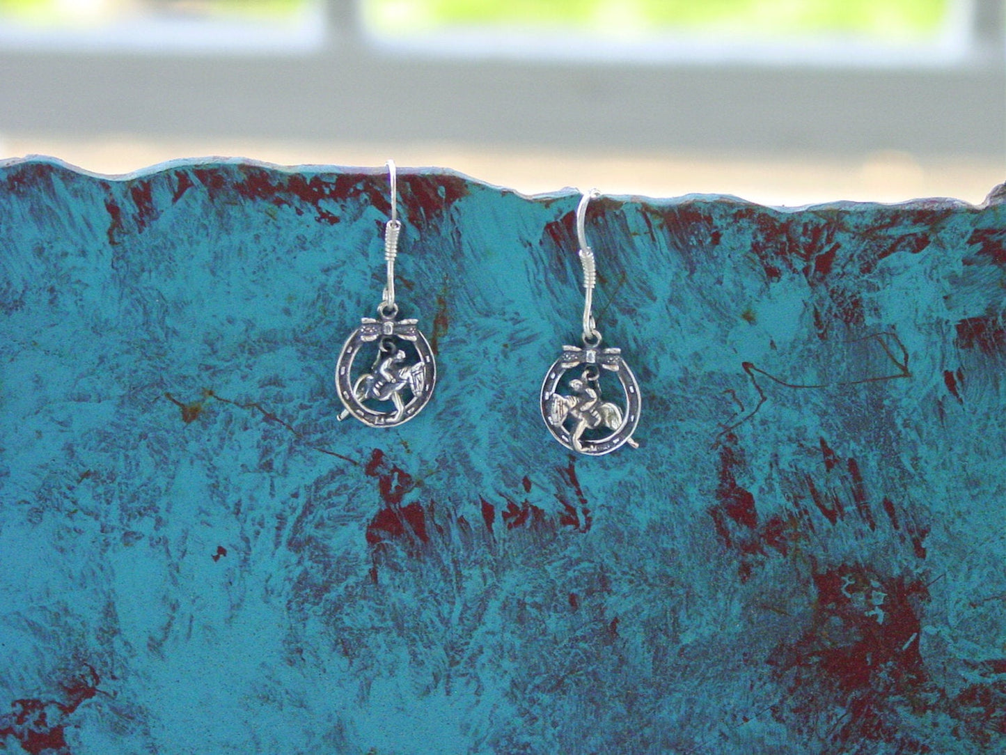 jumper horseshoe earrings
