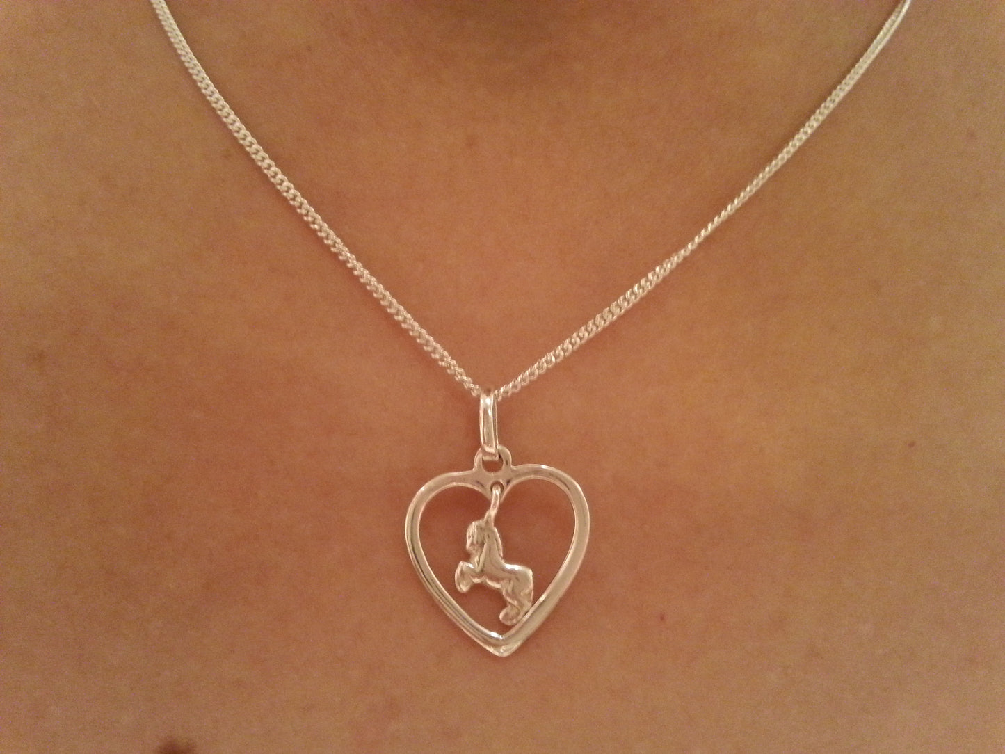 galloping horse in heart pendant