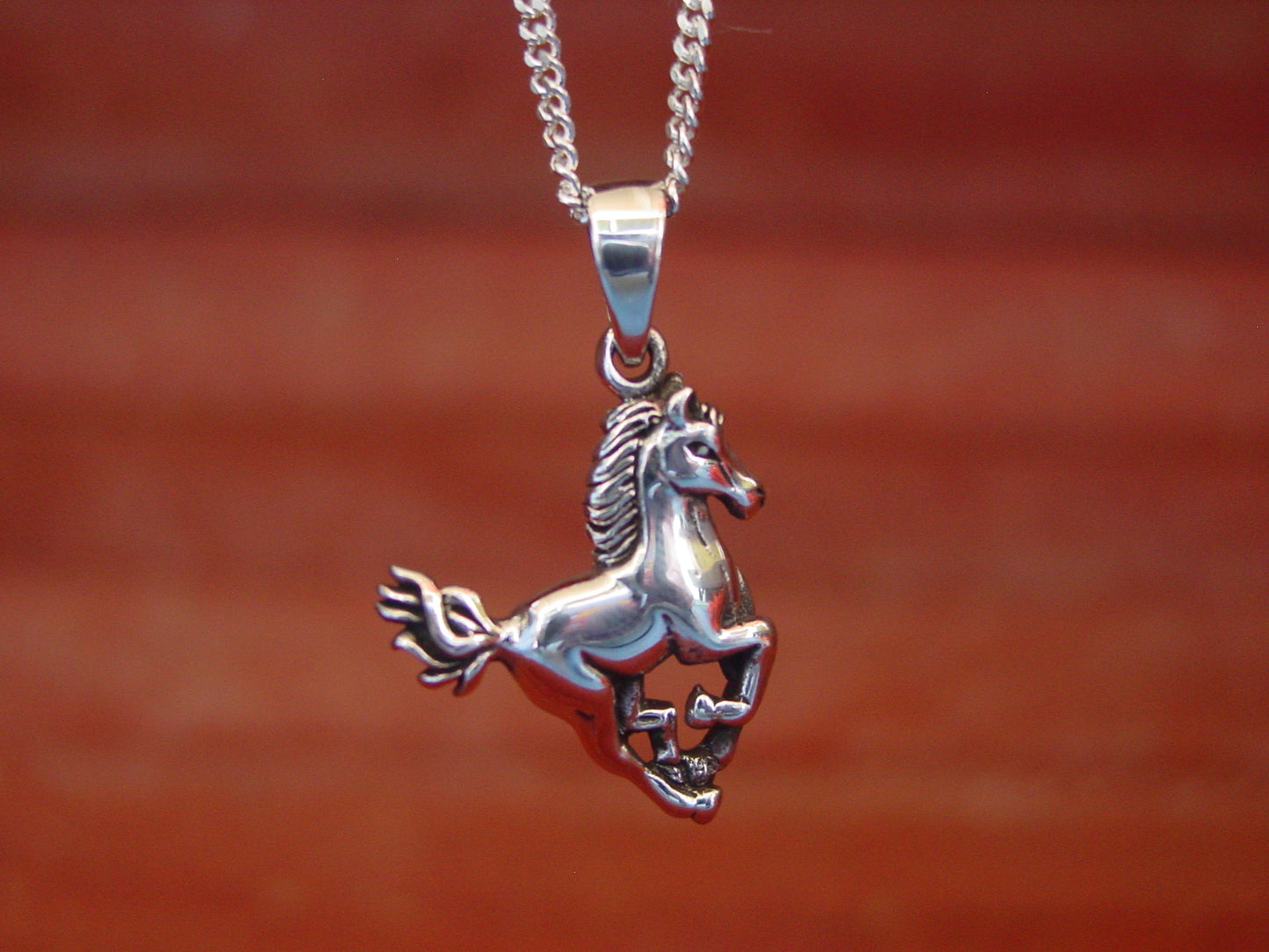 galloping horse pendant