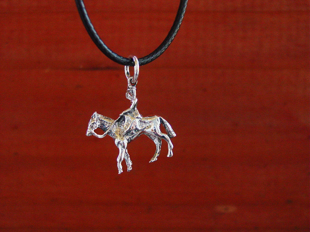 women riding horse silver