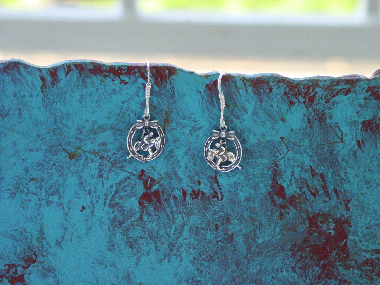 jumper horseshoe earrings